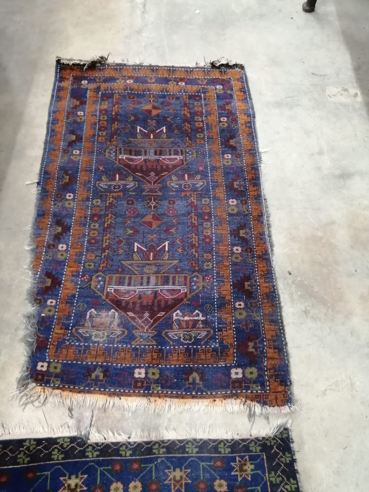 A Caucasian blue ground carpet, approx. 290 x 162cm together with a near pair of smaller North West Persian blue ground rugs